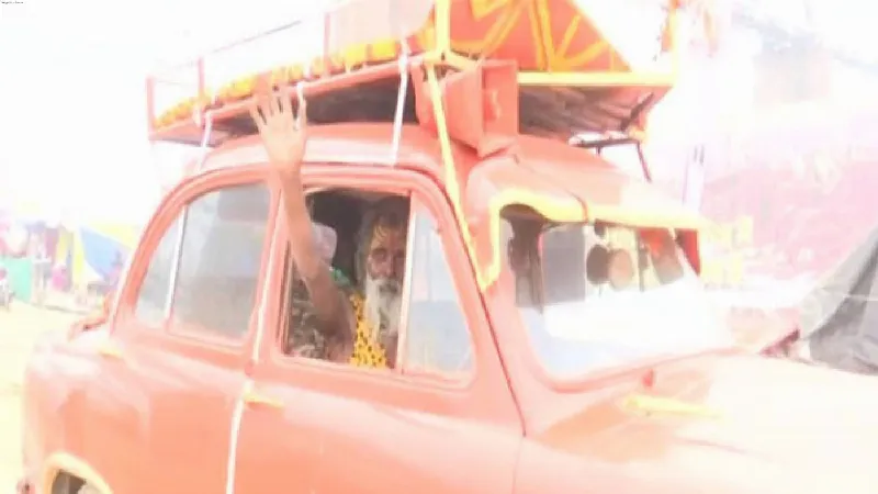 Ambassador Baba arrives at the Maha Kumbh Mela in his saffron colored car