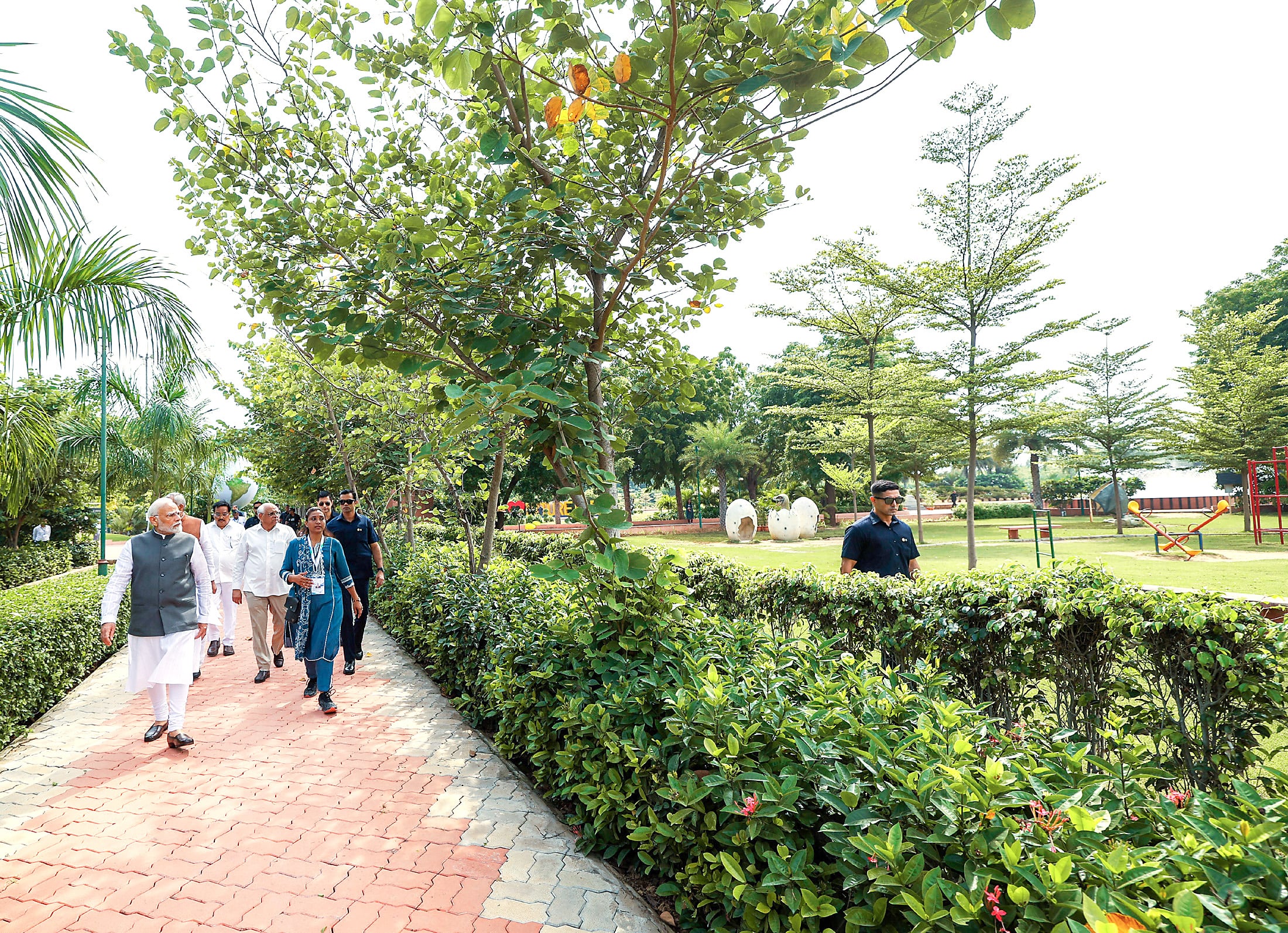 Prime Minister Narendra Modi takes a walk with Acharya Devvrat, Bhupendra Patel, CR Paatil and others in Nature Park.