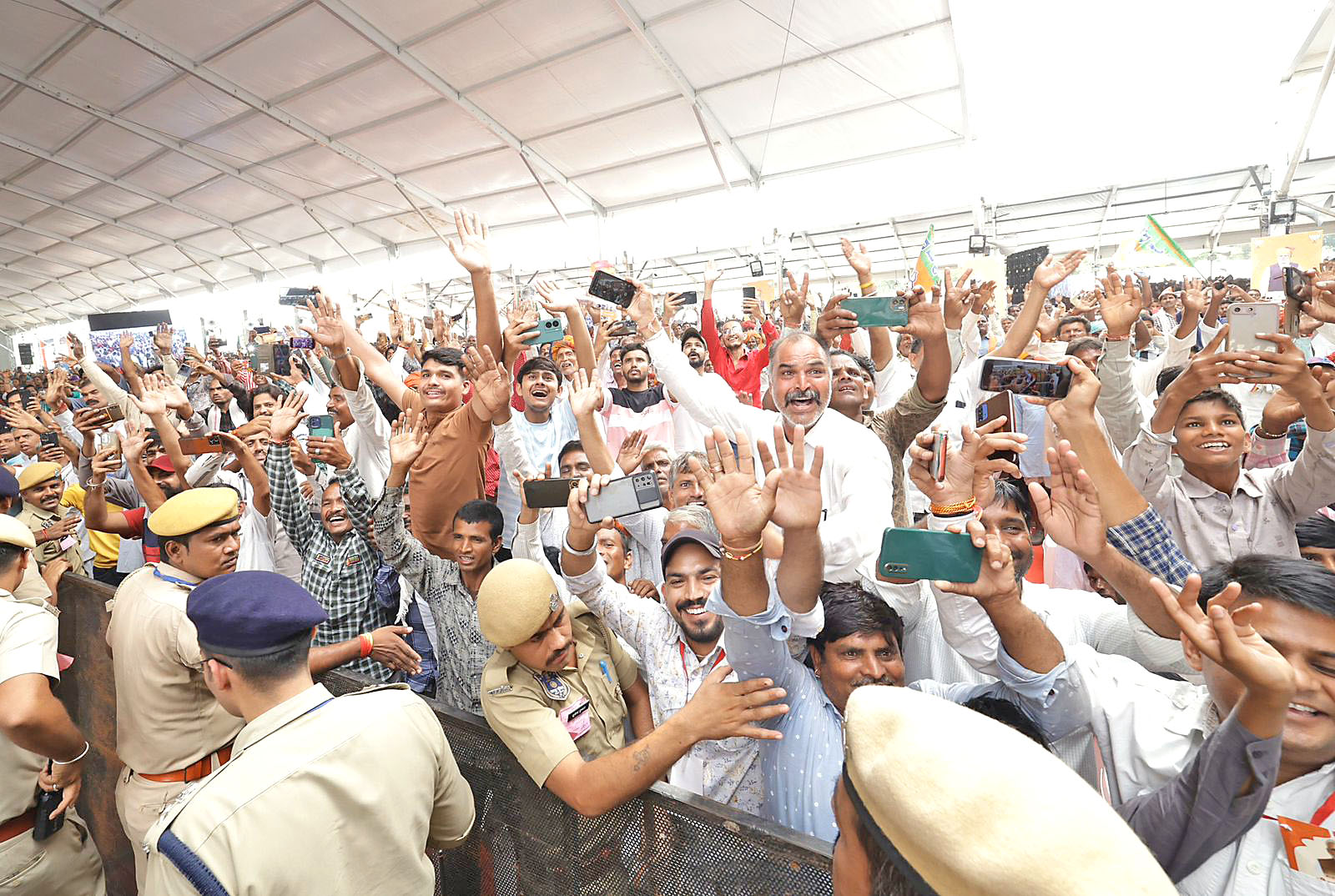 Enthusiastic supporters of PM Modi clicking selfies.