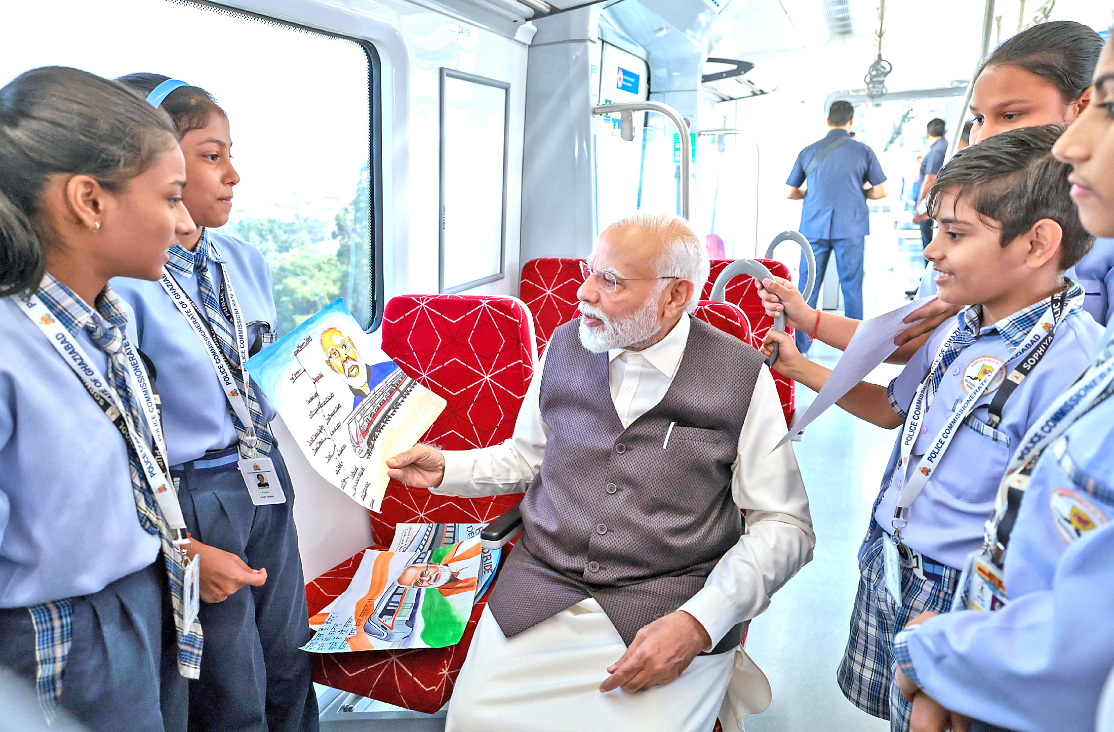 PM Modi hails his sketch presented to him by students.