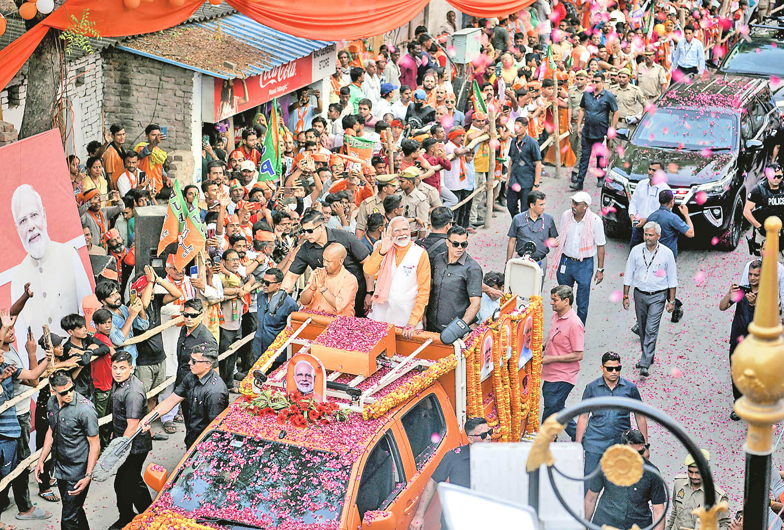 PM Modi and CM Yogi greet supporters.