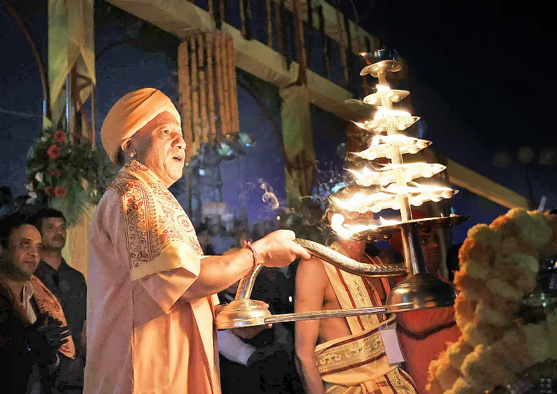 Yogi performs aarti on the banks of the Saryu river.