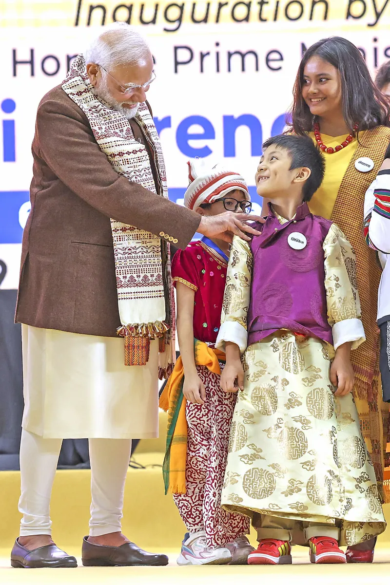 PM Modi pampers a girl child.