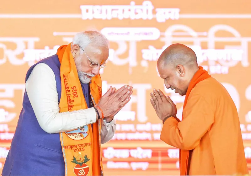 Yogi greets Modi.