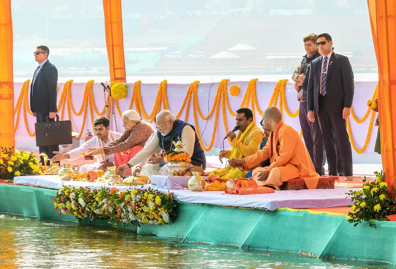 Modi, Anandiben Patel and Yogi Adityanath offer prayers at the Sangam Nose.