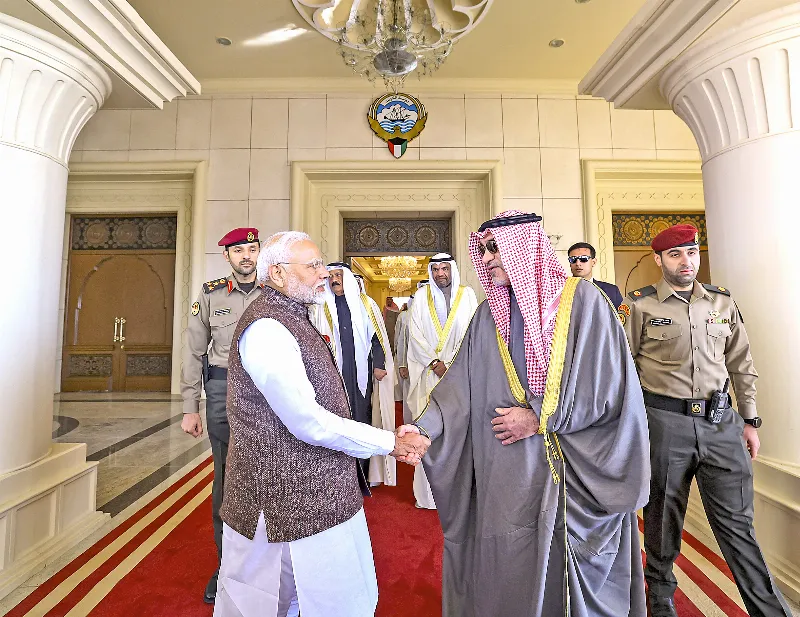 PM Modi and Sheikh Fahad Yousef Saud Al-Sabah greet each other.