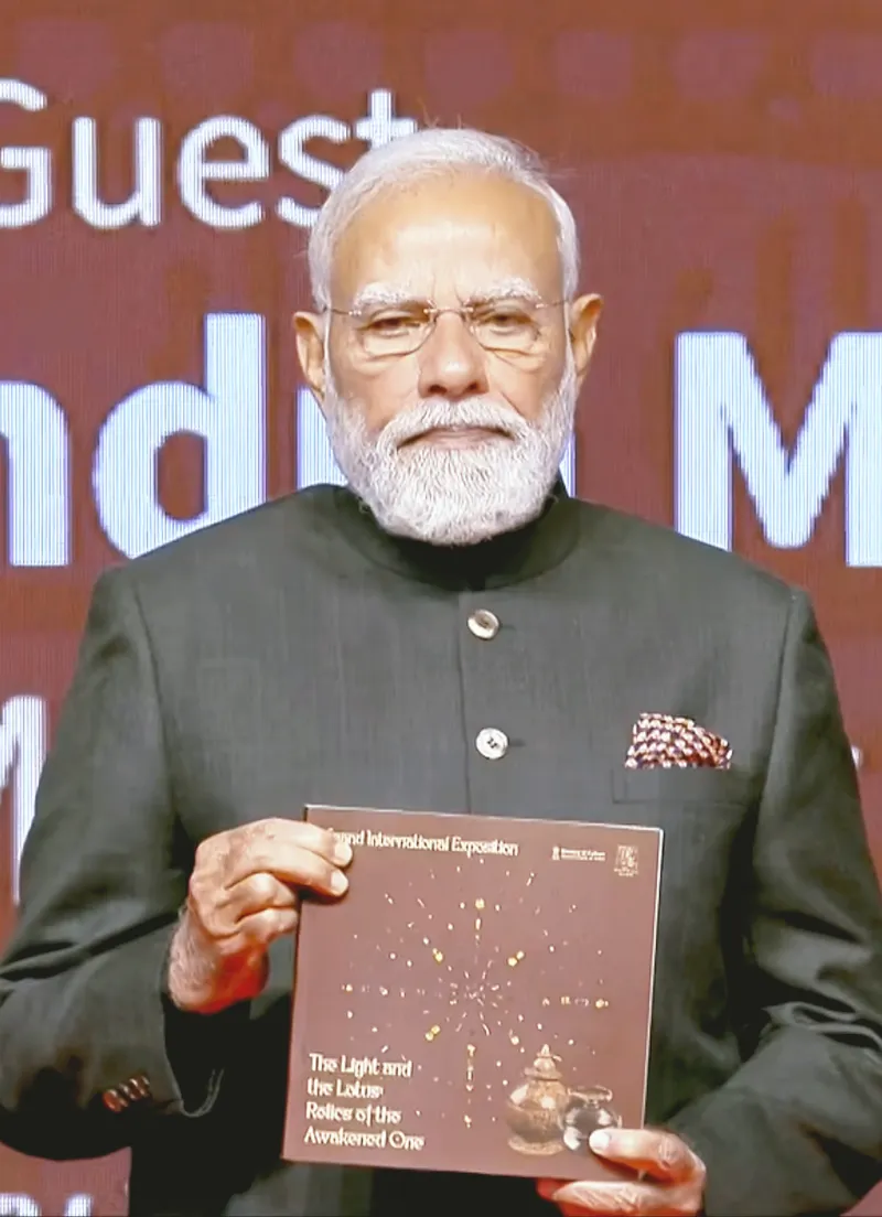 PM Narendra Modi releases the catalogue of the Grand International Exposition of Sacred Piprahwa Relics, titled 'The Light and The Lotus: Relics of the Awakened one', during the inaugural event, at Rai Pithora Cultural Complex in New Delhi on Saturday.