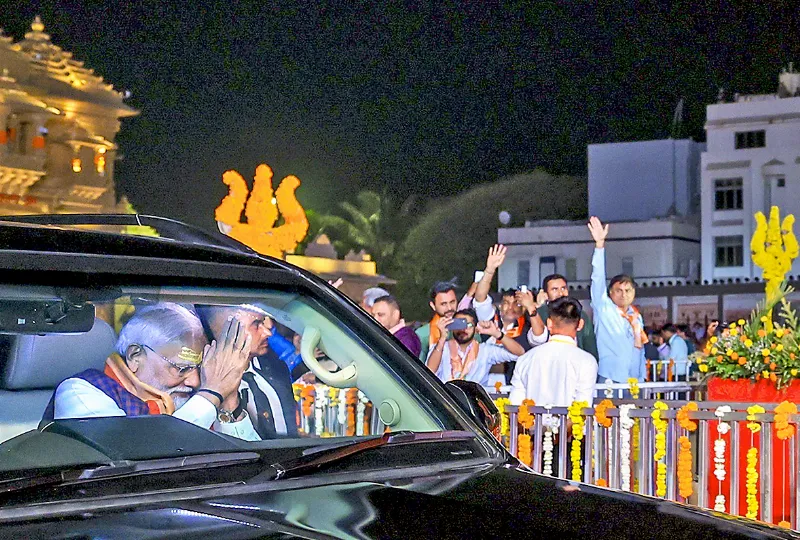 PM Modi waves as he arrives at Somnath Temple.
